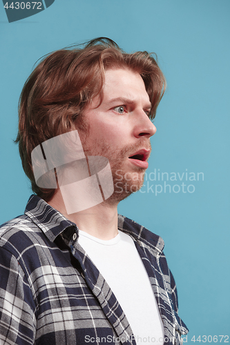 Image of Beautiful man in stress isolated on blue