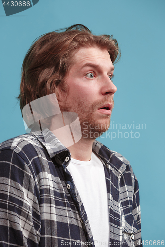 Image of Beautiful man in stress isolated on blue