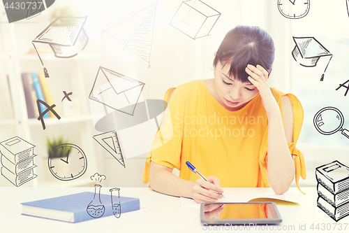 Image of bored asian woman student with tablet pc at home