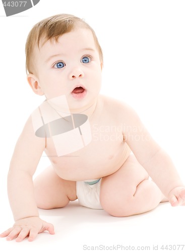 Image of crawling baby boy in diaper