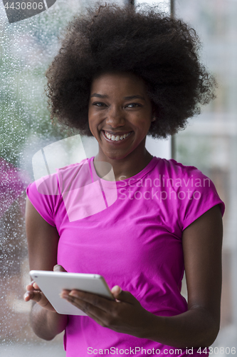 Image of african american woman using tablet