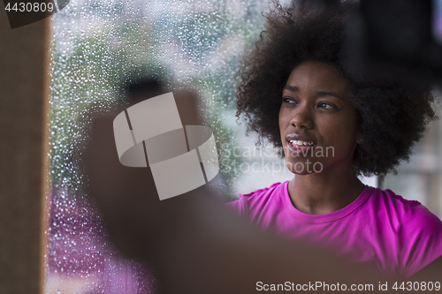 Image of african american woman using tablet