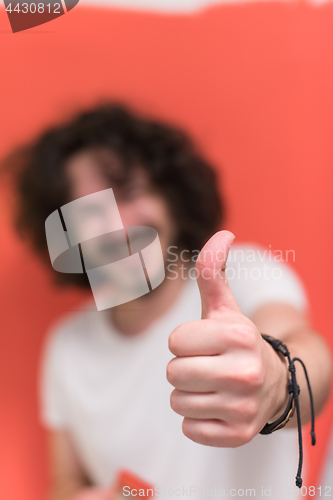 Image of man with funny hair over color background with brush