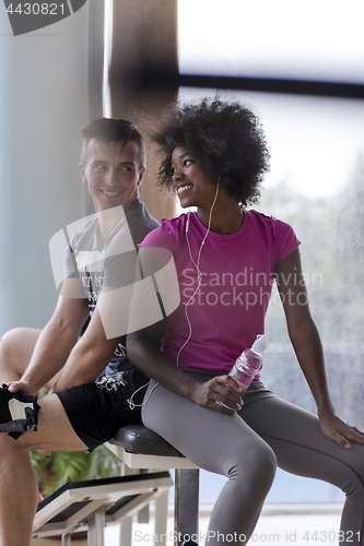 Image of couple in a gym have break