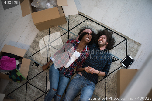 Image of Top view of attractive young multiethnic couple