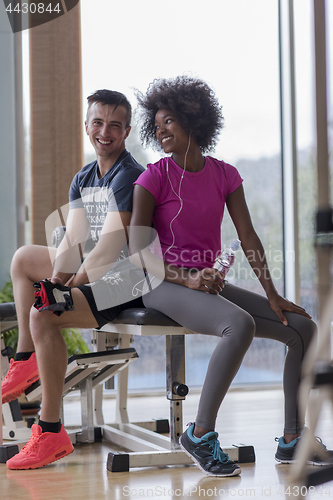 Image of couple in a gym have break