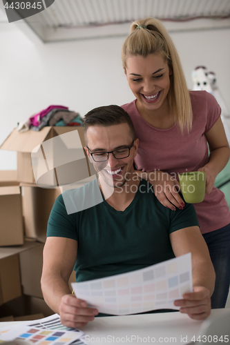 Image of Young couple moving in a new home