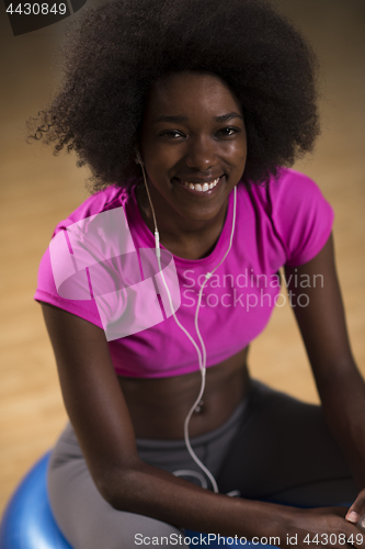 Image of woman  relaxing after pilates workout