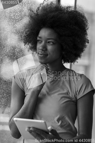 Image of african american woman using tablet