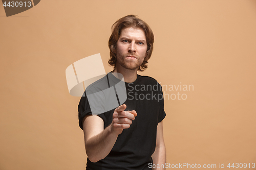 Image of The overbearing businessman point you and want you, half length closeup portrait on pastel background.