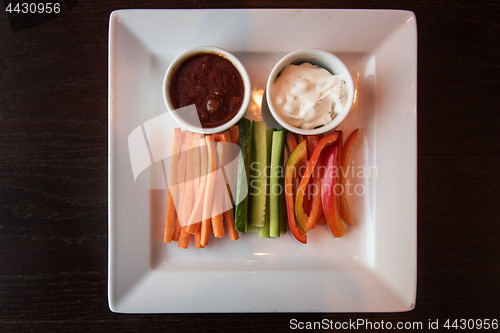 Image of Fresh carrot cucumber pepper and two sauce