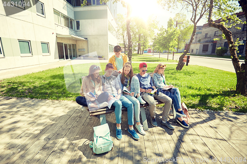 Image of group of students with notebooks at school yard