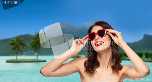 Image of woman with sunglasses over bora bora beach