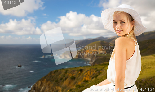 Image of woman over bixby creek bridge on big sur coast