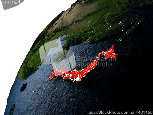 Image of Japan in red on Earth at night