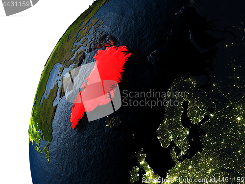 Image of Greenland in red on Earth at night