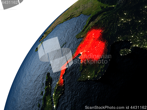 Image of Thailand in red on Earth at night