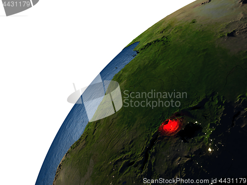 Image of Rwanda in red on Earth at night