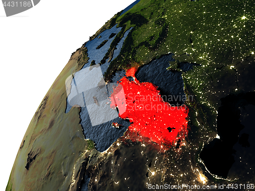 Image of Turkey in red on Earth at night