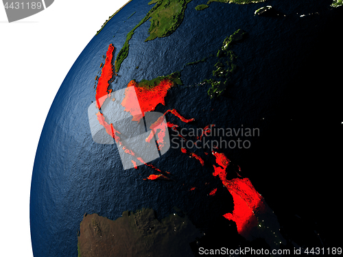 Image of Indonesia in red on Earth at night