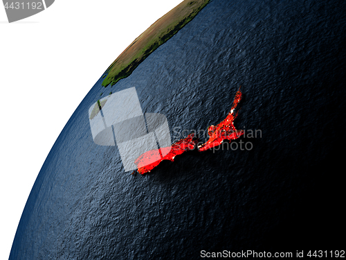 Image of New Zealand in red on Earth at night