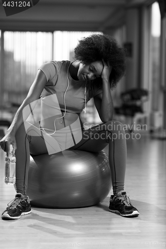 Image of woman  relaxing after pilates workout