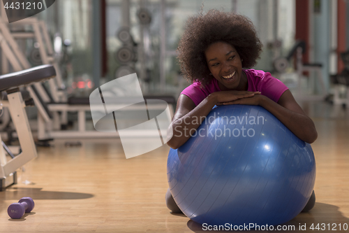 Image of woman  relaxing after pilates workout