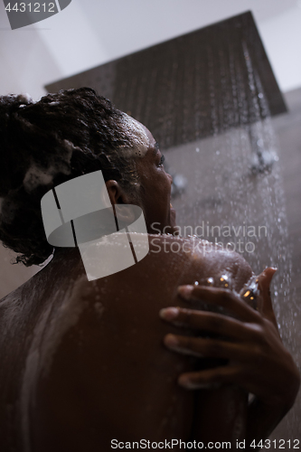 Image of African American woman in the shower