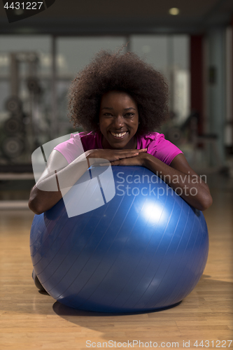 Image of woman  relaxing after pilates workout