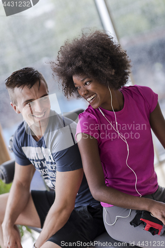 Image of couple in a gym have break