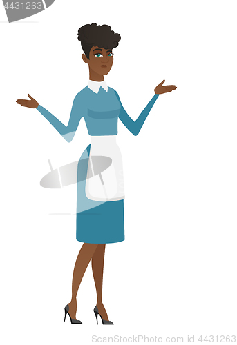 Image of African confused cleaner with spread arms