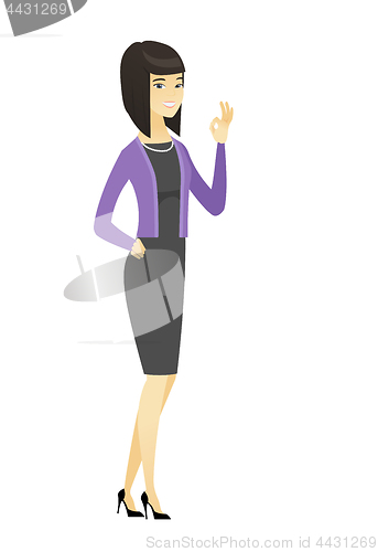 Image of Smiling business woman showing ok sign.