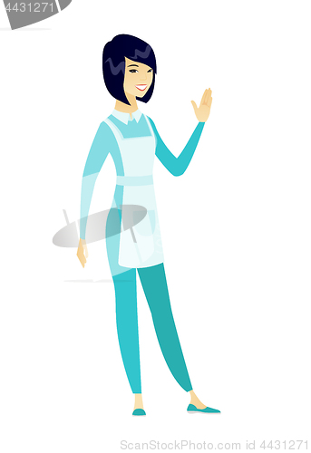 Image of Young asian cleaner waving her hand.