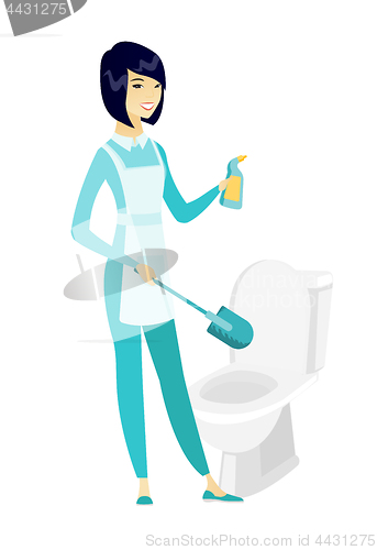Image of Cleaner in uniform cleaning toilet bowl.