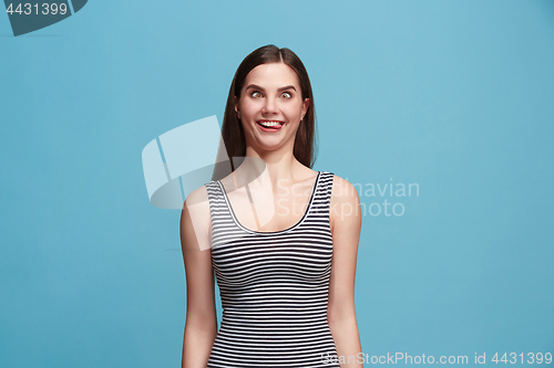 Image of The squint eyed woman with weird expression isolated on blue