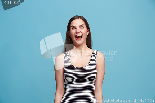 Image of The squint eyed woman with weird expression isolated on blue