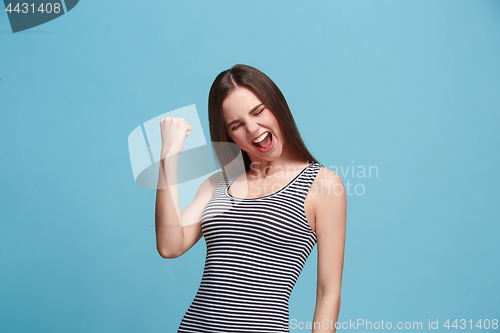 Image of Winning success woman happy ecstatic celebrating being a winner. Dynamic energetic image of female model