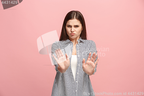 Image of Let me think. Doubtful pensive woman with thoughtful expression making choice against pink background