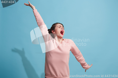 Image of Winning success woman happy ecstatic celebrating being a winner. Dynamic energetic image of female model