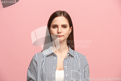 Image of Beautiful woman looking suprised and bewildered isolated on pink