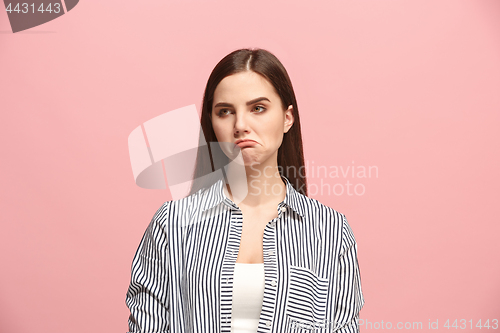 Image of Beautiful woman looking suprised and bewildered isolated on pink