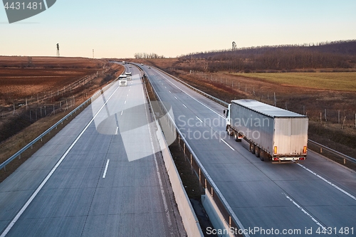 Image of Highway with cargo trucks