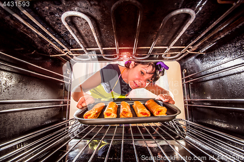 Image of Cooking in the oven at home.