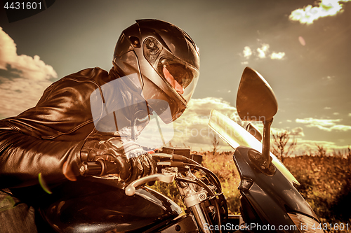 Image of Biker racing on the road