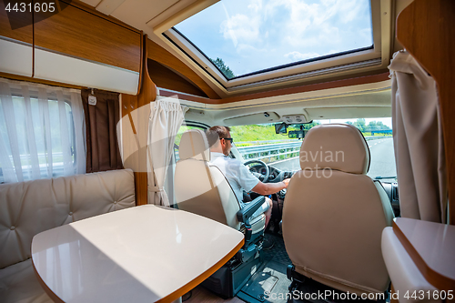 Image of Man driving on a road in the Camper Van RV