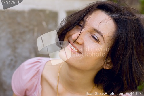 Image of brunet woman with closed eyes