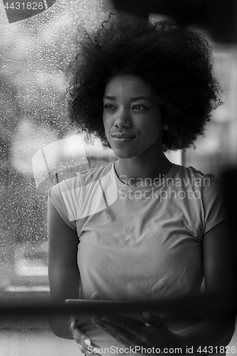 Image of african american woman using tablet