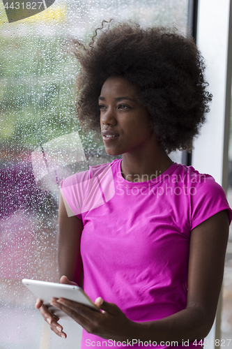 Image of african american woman using tablet