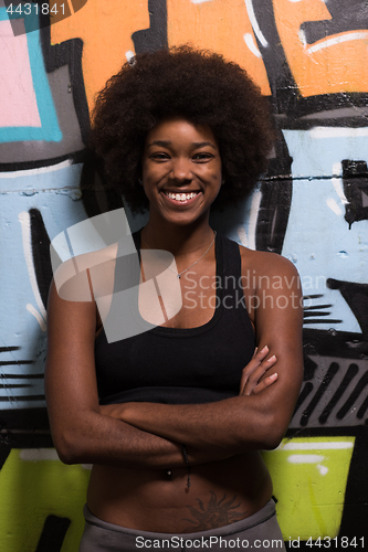 Image of black woman after a workout at the gym