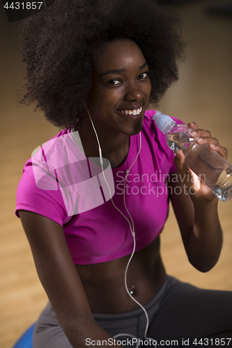 Image of woman  relaxing after pilates workout